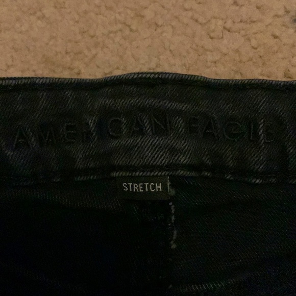 Black stretchy American Eagle jeans with a cross over waist - Picture 5 of 6